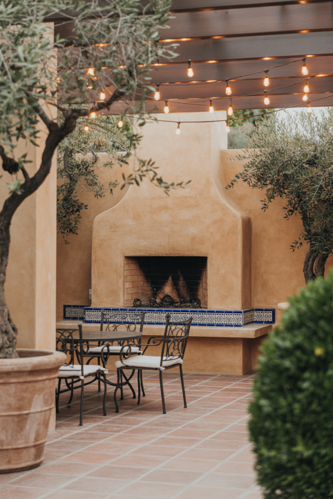 5. Mediterranean-Style Fireplace with Terra-Cotta Touch