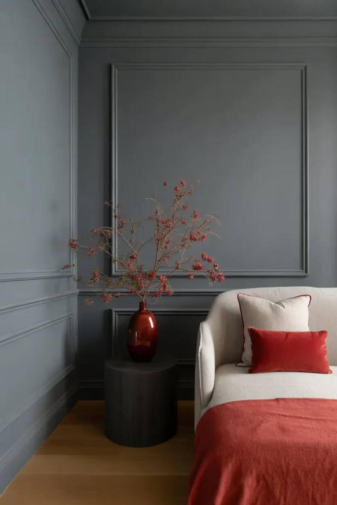 7. Grey Walls with Black Trim and Subtle Red Decor